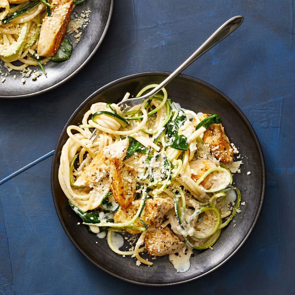 creamy chicken and zoodle spaghetti on a black plate