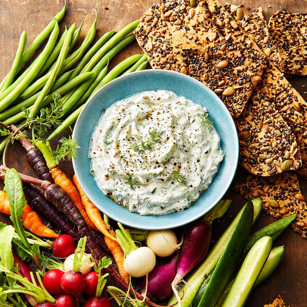 dill dip with vegetables and crackers