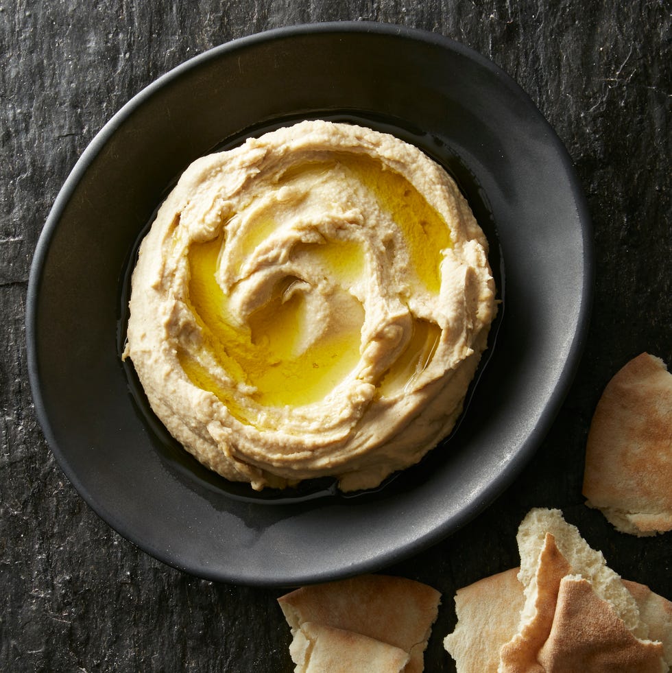 homemade hummus with torn pita