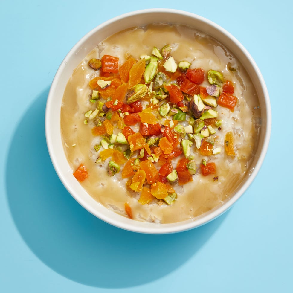 oatmeal with pistachios and apricots on a blue background